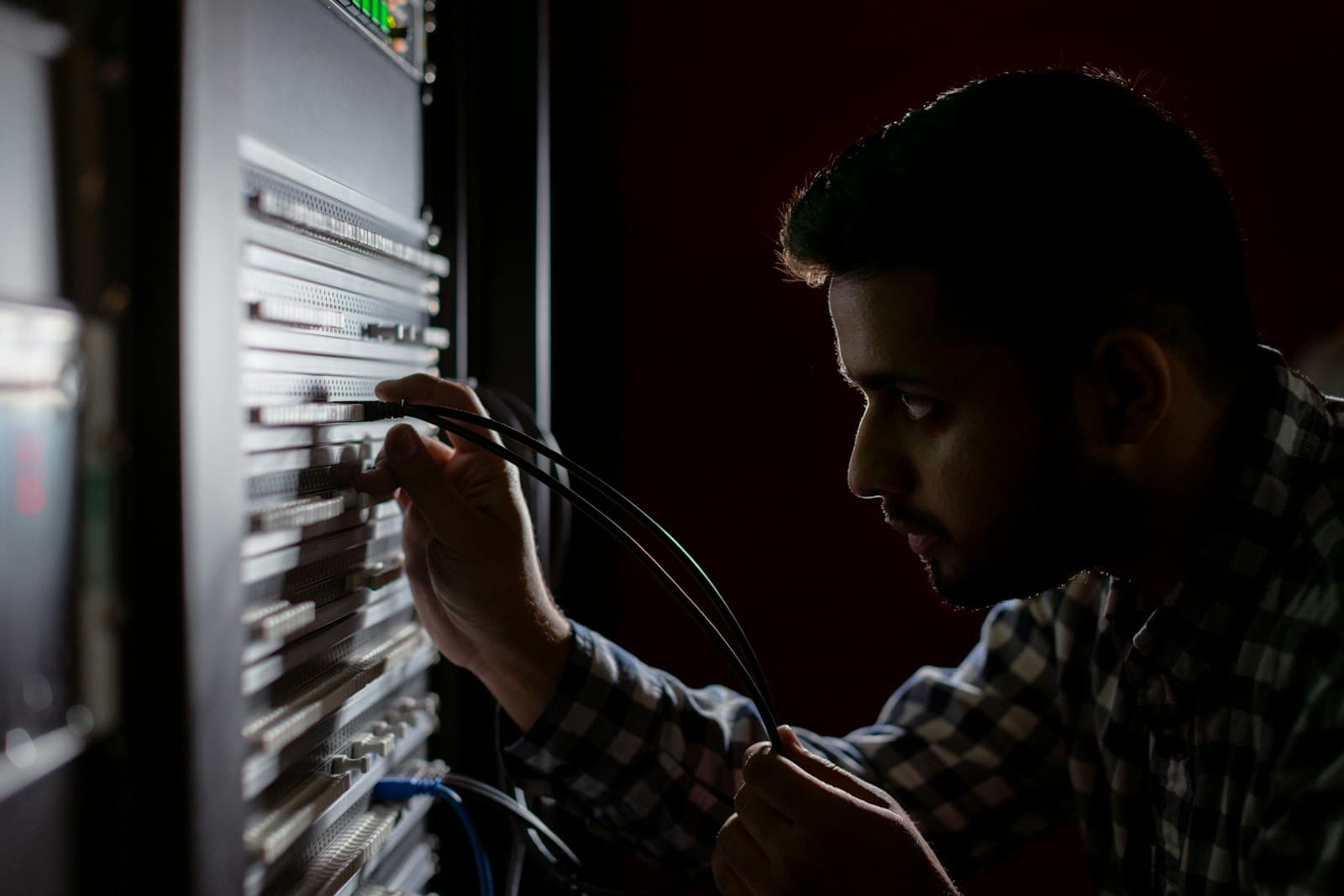 Technician working on equipment wiring